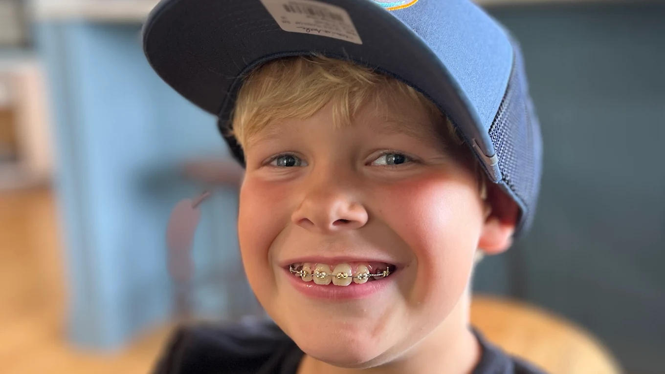 Granite Coast Orthodontics patient smiling in braces